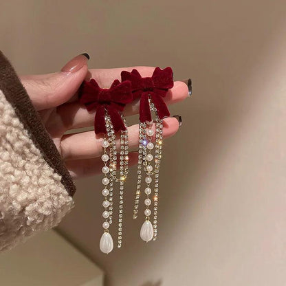 Long Pearl Drop Earrings with Bowknot Detail by HitMyNeed