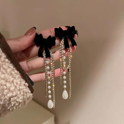 Long Pearl Drop Earrings with Bowknot Detail by HitMyNeed