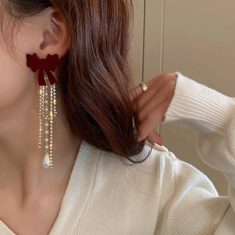Long Pearl Drop Earrings with Bowknot Detail by HitMyNeed