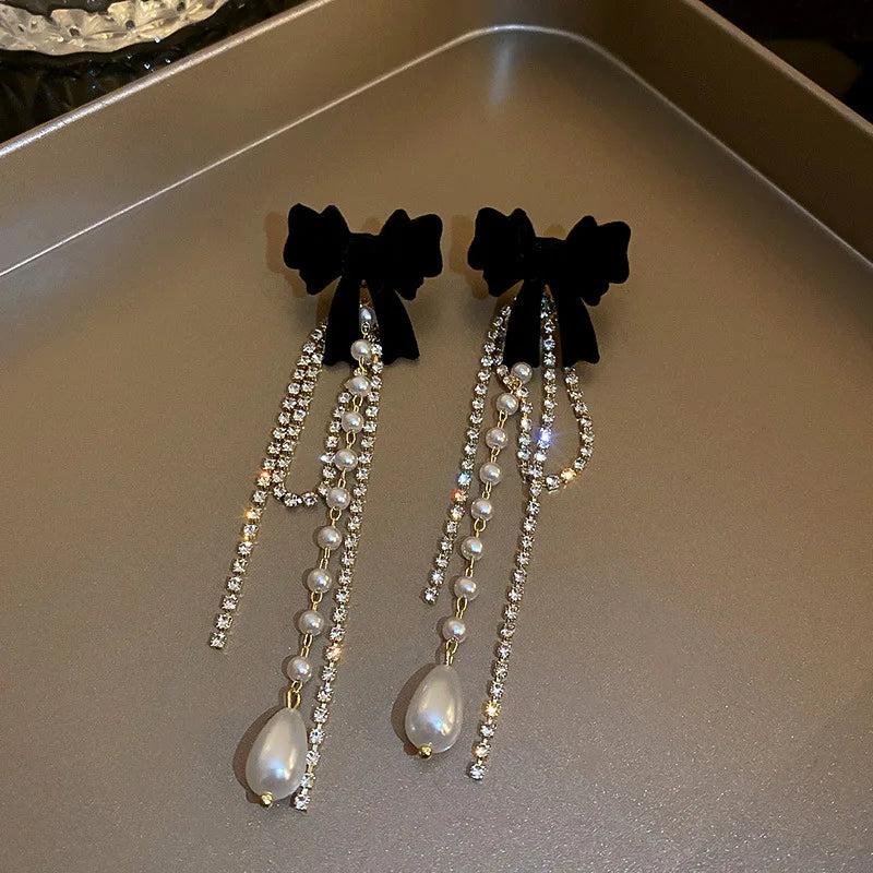 Long Pearl Drop Earrings with Bowknot Detail by HitMyNeed