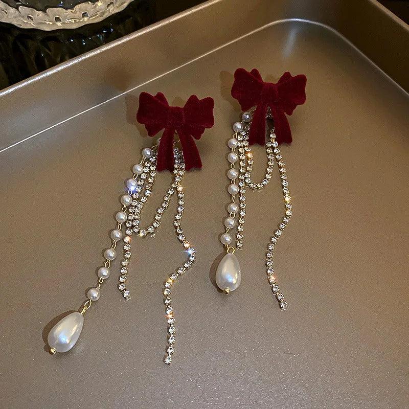 Long Pearl Drop Earrings with Bowknot Detail by HitMyNeed