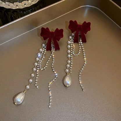 Long Pearl Drop Earrings with Bowknot Detail by HitMyNeed