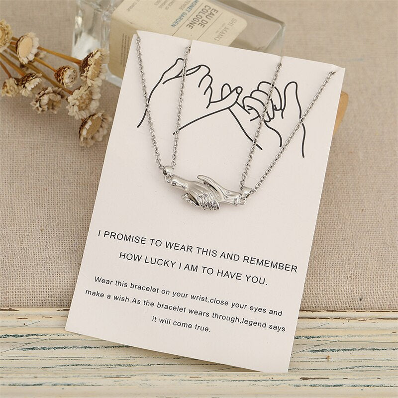 Magnetic Holding Hands Couple Necklace Set by HitMyNeed