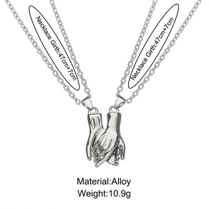 Magnetic Holding Hands Couple Necklace Set by HitMyNeed