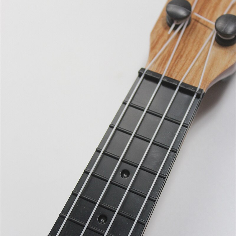 Mini 4-String Ukulele Toy for Kids - Beginner Musical Instrument (35cm) by HitMyNeed