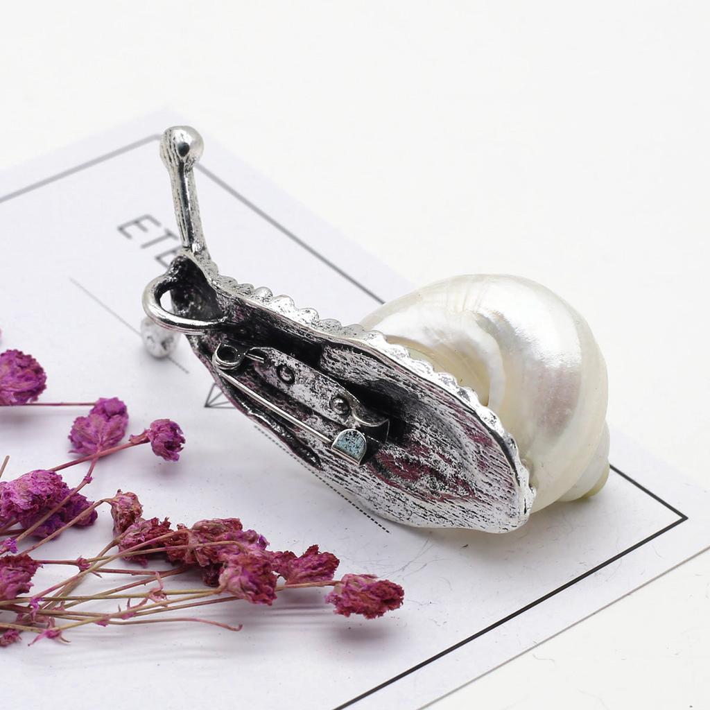 Shiny Metal Snail Brooch with Shell Detail by HitMyNeed